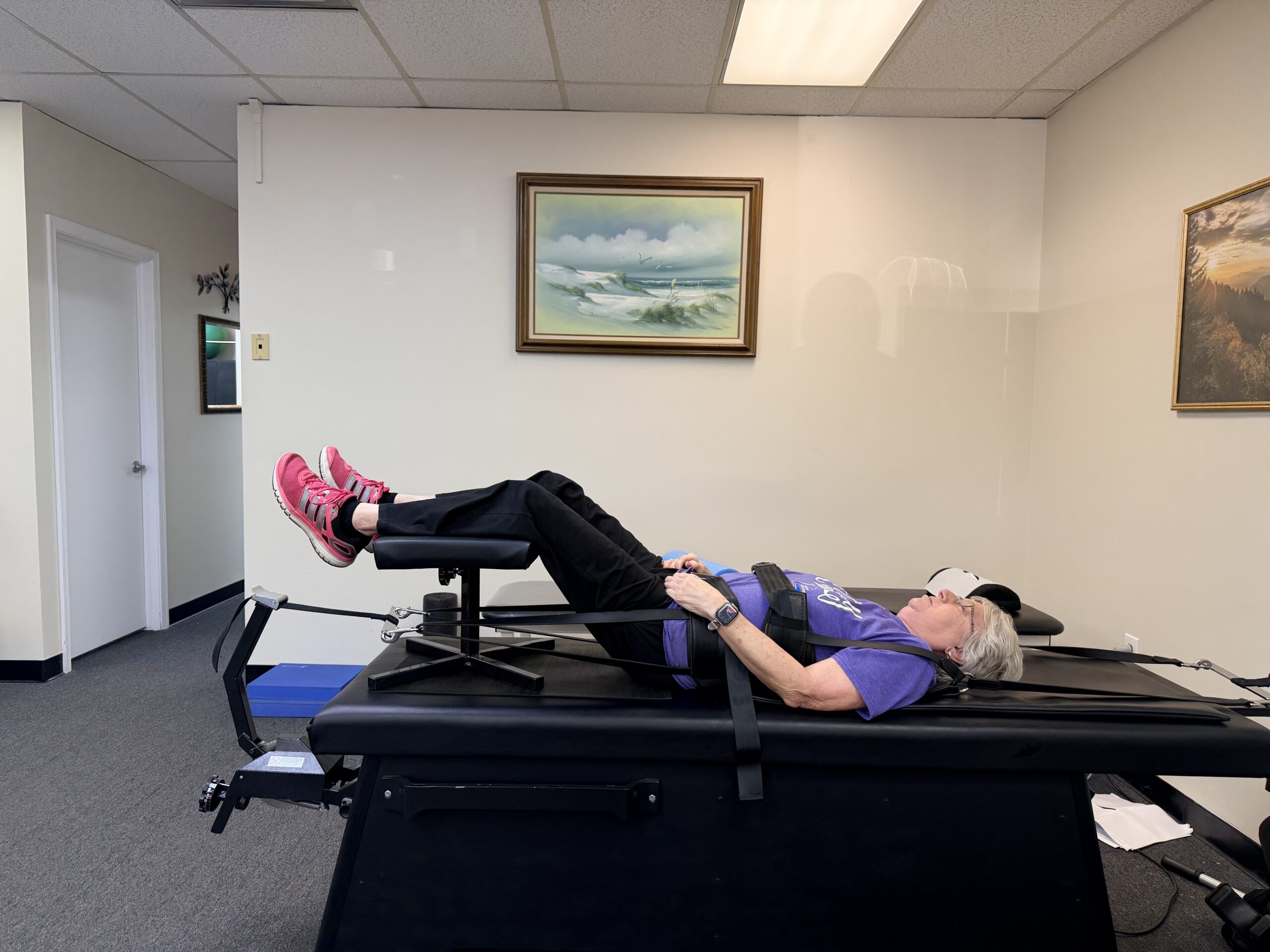 Patient receiving spinal decompression traction at Relief Chiropractic in Levittown, PA